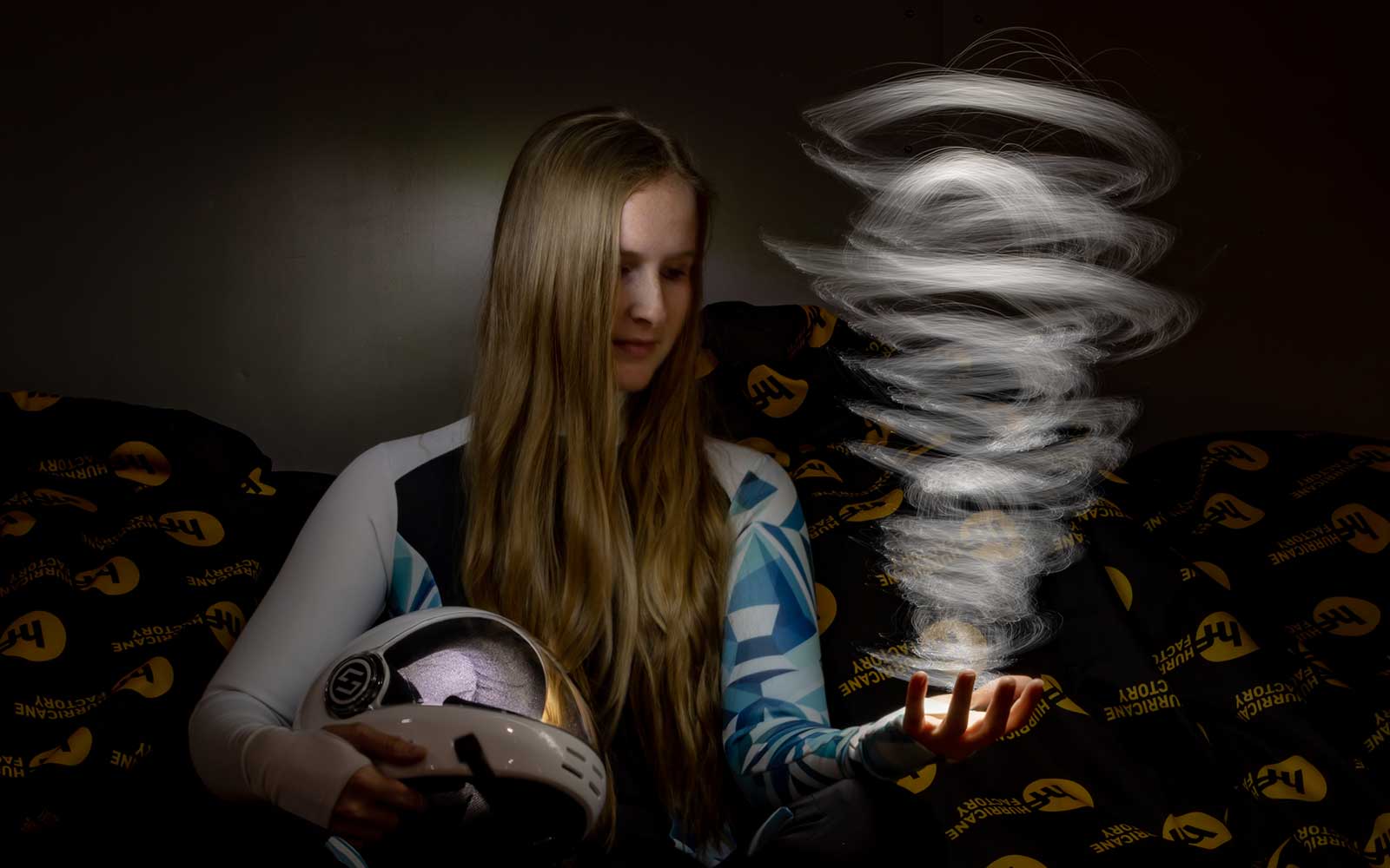Light Painting Portrait of Luise with her Helmet and a Hurricane in her hand